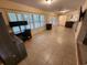 Well-lit office space with a large window, modern desk setup, and tiled flooring for a professional atmosphere at 243 Harbor Blvd, Port Charlotte, FL 33954
