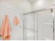 Bright bathroom with a glass enclosed shower and neutral decor, offering a clean and modern feel at 2508 Magnolia Cir, North Port, FL 34289