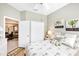 Comfortable bedroom with tile flooring and a glimpse of the adjacent office, ideal for relaxing or working at 2508 Magnolia Cir, North Port, FL 34289