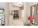 Hallway view showcasing tile flooring and seamless transition to the office, creating a connected living space at 2508 Magnolia Cir, North Port, FL 34289