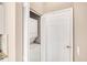 A laundry closet features a stackable washer and dryer unit with bi-fold doors at 2508 Magnolia Cir, North Port, FL 34289