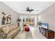 Comfortable living room with stylish furnishings, sliding glass doors to screened lanai, and relaxing atmosphere at 2508 Magnolia Cir, North Port, FL 34289