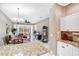 Inviting living room with abundant natural light, sliding glass doors, and an adjacent dining area at 2508 Magnolia Cir, North Port, FL 34289