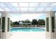 View of pool from under an arbor at the community at 2508 Magnolia Cir, North Port, FL 34289