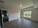 Bedroom with backyard access and beautiful wood-look floors and backyard access at 25156 Rosamond Ct, Punta Gorda, FL 33983