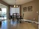 Dining room with table, chandelier, and window with view to the outdoor pool area at 25263 Padre Ln, Punta Gorda, FL 33983