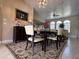 Elegant dining room featuring a modern chandelier, comfortable seating, and stylish decor, perfect for entertaining guests at 25263 Padre Ln, Punta Gorda, FL 33983