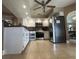 Spacious kitchen featuring stainless steel appliances, granite countertops, and tile flooring at 25263 Padre Ln, Punta Gorda, FL 33983