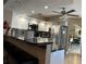 Open kitchen boasts granite countertops, stainless appliances, and an eat-in bar at 25263 Padre Ln, Punta Gorda, FL 33983