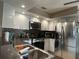 Kitchen featuring stainless steel appliances and dark countertops at 25263 Padre Ln, Punta Gorda, FL 33983