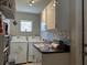 Well-organized laundry area with modern appliances, countertop space, and ample storage at 25263 Padre Ln, Punta Gorda, FL 33983