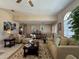 Inviting living room featuring neutral-toned furnishings, stylish decor, and ample natural light, creating a warm ambiance at 25263 Padre Ln, Punta Gorda, FL 33983