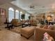 Large living room featuring vaulted ceilings, neutral decor and comfortable seating arrangement at 25263 Padre Ln, Punta Gorda, FL 33983