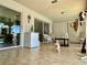 Enclosed lanai with tiled floors, ceiling fan, bright light and access to pool at 25263 Padre Ln, Punta Gorda, FL 33983