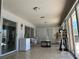 Enclosed lanai with tiled floors, ceiling fan, bright light and access to pool at 25263 Padre Ln, Punta Gorda, FL 33983