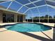 Beautiful pool area with a screened enclosure, perfect for relaxing and enjoying the outdoors at 25263 Padre Ln, Punta Gorda, FL 33983