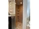 Tiled shower with glass door and built-in shelving, offering a spa-like experience at 25263 Padre Ln, Punta Gorda, FL 33983