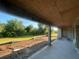Unfinished concrete patio with view of lawn at 26209 Madras Ct, Punta Gorda, FL 33983