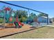 A vibrant playground with slides, swings, and climbing structures offers endless entertainment for children at 26209 Madras Ct, Punta Gorda, FL 33983