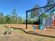Community playground features swings, climbing structure, and other play equipment for outdoor fun at 26209 Madras Ct, Punta Gorda, FL 33983