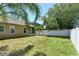 Spacious backyard featuring lush lawn and a privacy fence, offering a serene outdoor space at 27854 Arrowhead Cir, Punta Gorda, FL 33982