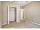This bright bedroom features an open closet and neutral tones, creating a serene and adaptable living space at 27854 Arrowhead Cir, Punta Gorda, FL 33982