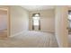 Bedroom featuring carpet flooring, window with curtain, and closet at 27854 Arrowhead Cir, Punta Gorda, FL 33982