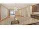 Open-concept living space featuring granite counters and stainless sink in a well lit home at 27854 Arrowhead Cir, Punta Gorda, FL 33982