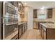 Modern kitchen showcasing granite countertops, stainless steel appliances, and ample storage at 27854 Arrowhead Cir, Punta Gorda, FL 33982