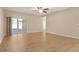 Large living room with wood floors and access to the screened in lanai at 27854 Arrowhead Cir, Punta Gorda, FL 33982