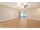 Bright living room featuring wood floors and access to a screened patio at 27854 Arrowhead Cir, Punta Gorda, FL 33982