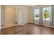 Bright living room featuring hardwood floors and lots of natural light from the windows at 27854 Arrowhead Cir, Punta Gorda, FL 33982