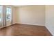 Bright living room featuring hardwood floors and lots of natural light from the windows at 27854 Arrowhead Cir, Punta Gorda, FL 33982