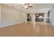 Open-concept living room leads to a kitchen with dark wood cabinets, stainless appliances, and an island with barstool seating at 27854 Arrowhead Cir, Punta Gorda, FL 33982