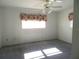Bright bedroom with carpet, windows, and simple decor at 296 Milford St, Port Charlotte, FL 33953
