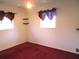 Bedroom featuring carpeting, a ceiling fan, and natural light at 296 Milford St, Port Charlotte, FL 33953