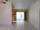 Dining area with tile floors, chandelier, and sliding doors for natural light at 296 Milford St, Port Charlotte, FL 33953