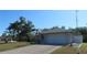 Lovely single-story home with a well-manicured lawn and a convenient two-car garage at 296 Milford St, Port Charlotte, FL 33953