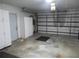Spacious garage with ample storage space and an automatic door at 296 Milford St, Port Charlotte, FL 33953