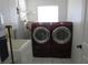 Laundry room featuring Samsung washer and dryer and a utility sink at 296 Milford St, Port Charlotte, FL 33953
