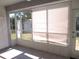 Bright sunroom with white tile flooring and views of the yard at 296 Milford St, Port Charlotte, FL 33953