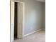 Bedroom showcasing neutral walls, carpet flooring, and a closet with bifold doors at 3293 Cincinnati St, North Port, FL 34286
