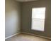 Bright bedroom with neutral walls, carpet flooring, and a large window offering plenty of natural light at 3293 Cincinnati St, North Port, FL 34286