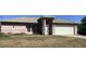 Charming single-story home with a two-car garage, light pink exterior, and well-lit entry at 3293 Cincinnati St, North Port, FL 34286