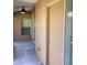 Covered patio with fan, sliding glass doors, and access to the backyard for outdoor enjoyment at 3293 Cincinnati St, North Port, FL 34286