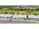 Aerial view of the community showcasing the building's rooftops, parking, and lush greenery at 3300 Loveland Blvd # 2801, Punta Gorda, FL 33980