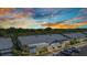 Low aerial view of condo community against colorful dusk sky at 3300 Loveland Blvd # 2801, Punta Gorda, FL 33980