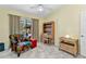 Bedroom features a vaulted ceiling, tiled floor, furnishings and sliding glass doors to the lanai at 3300 Loveland Blvd # 2801, Punta Gorda, FL 33980