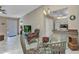Cozy dining area with modern lighting, adjacent to the kitchen, and views of the living space at 3300 Loveland Blvd # 2801, Punta Gorda, FL 33980