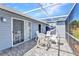 A screened lanai with tiled floors, an overhead cover, and a patio furniture set at 3300 Loveland Blvd # 2801, Punta Gorda, FL 33980